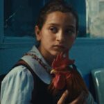 ‘द प्रेसिडेंट्स केक’ फिल्म का दृश्य जिसमें एक बच्ची युद्धग्रस्त इराक में केक बनाने की कोशिश कर रही है।