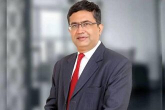 NSE CEO आशीष चौहान बिजनेस ग्रोथ, कंपनी लिस्टिंग और शेयर बाजार पर संबोधित करते हुए।